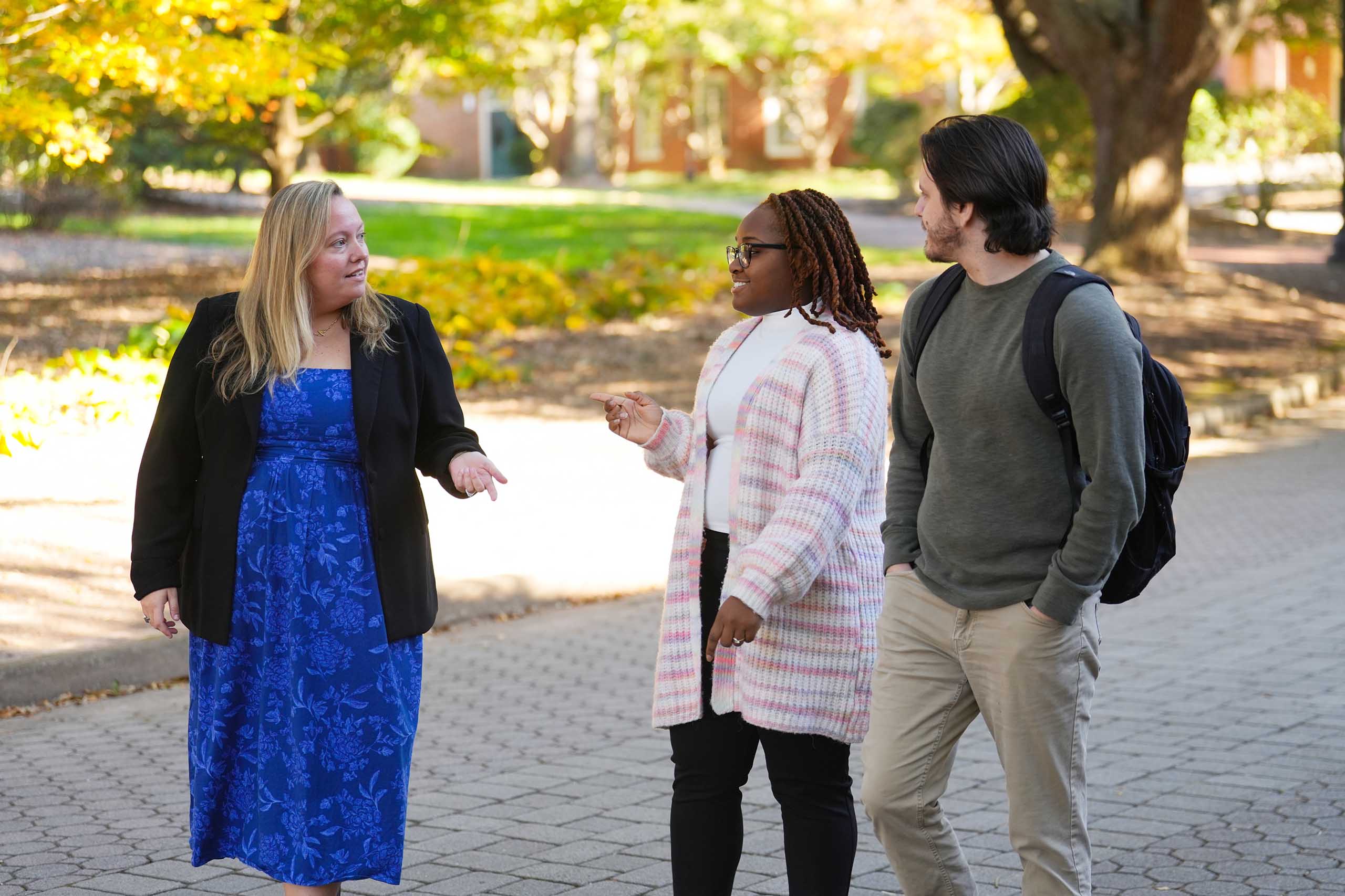 MS-CEM students walking with the program coordinator