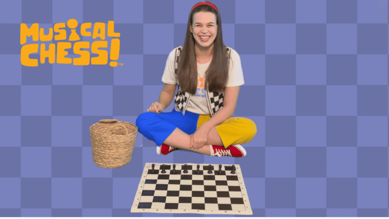 Promotional image for Musical Chess featuring an instructor seated cross-legged above a chessboard against a blue checkered background. The person wears colorful blue-and-yellow pants and red sneakers and sits beside a woven basket. The Musical Chess logo appears in the upper left corner. Black chess pieces are arranged along the back row of the chessboard, emphasizing the educational program's combination of music and chess learning.
