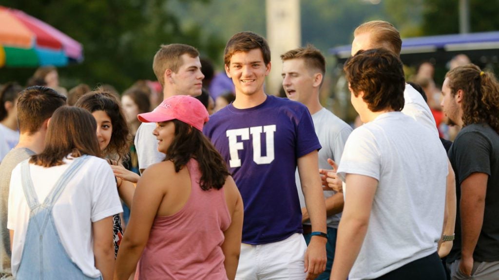 Student in a crowd at carnival