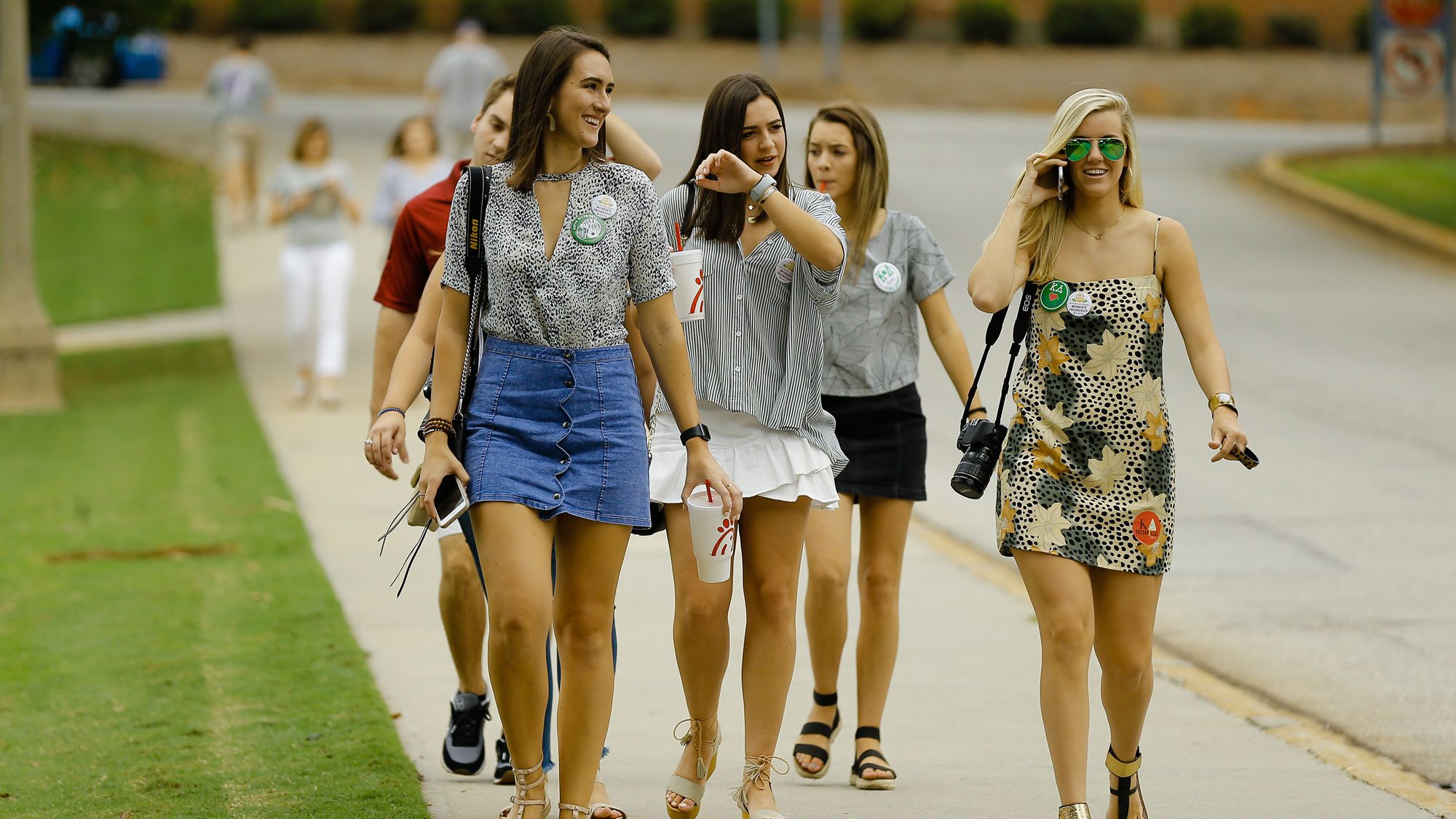 Students walking back from football game during family weekend