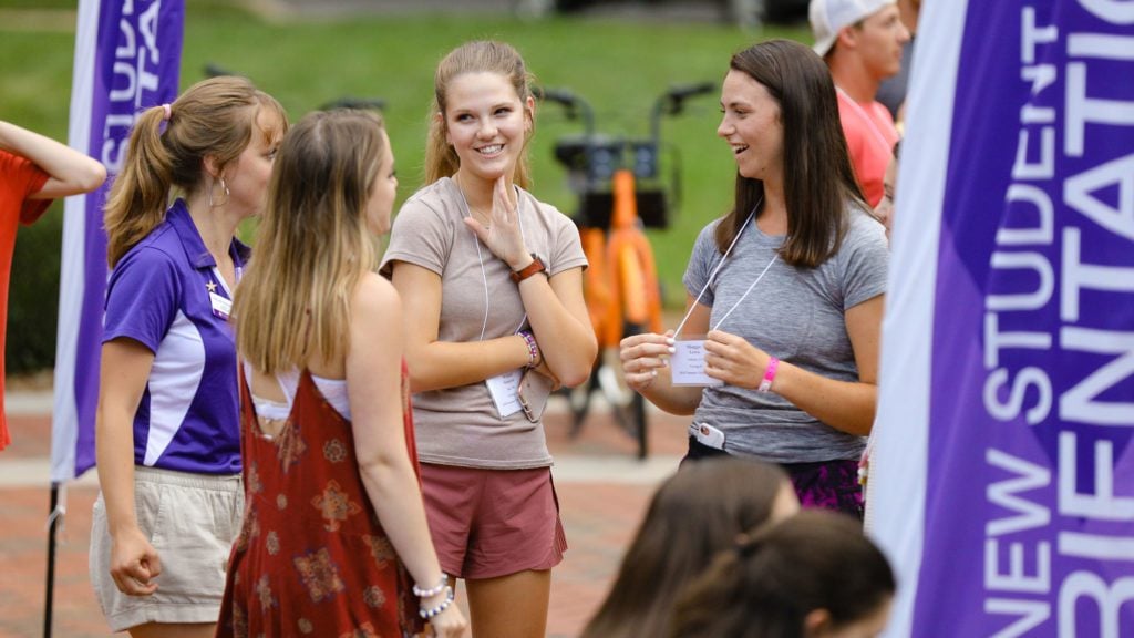 Students talking in a group during orientation