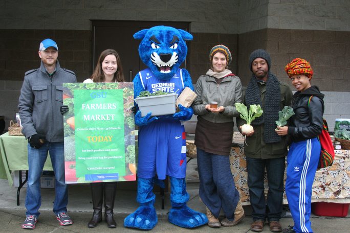 Asman with Pounce and GSU students at the inaugural Georgia State Farmers Market