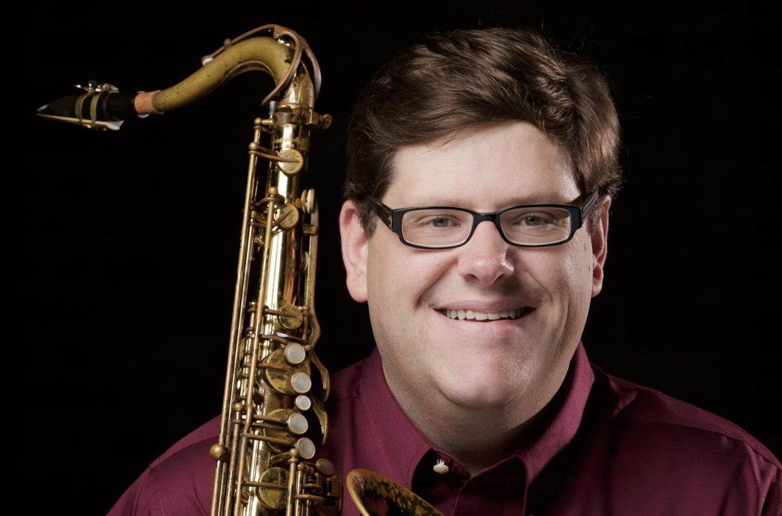 |white man wearing glasses, holding saxophone, Matt Olson