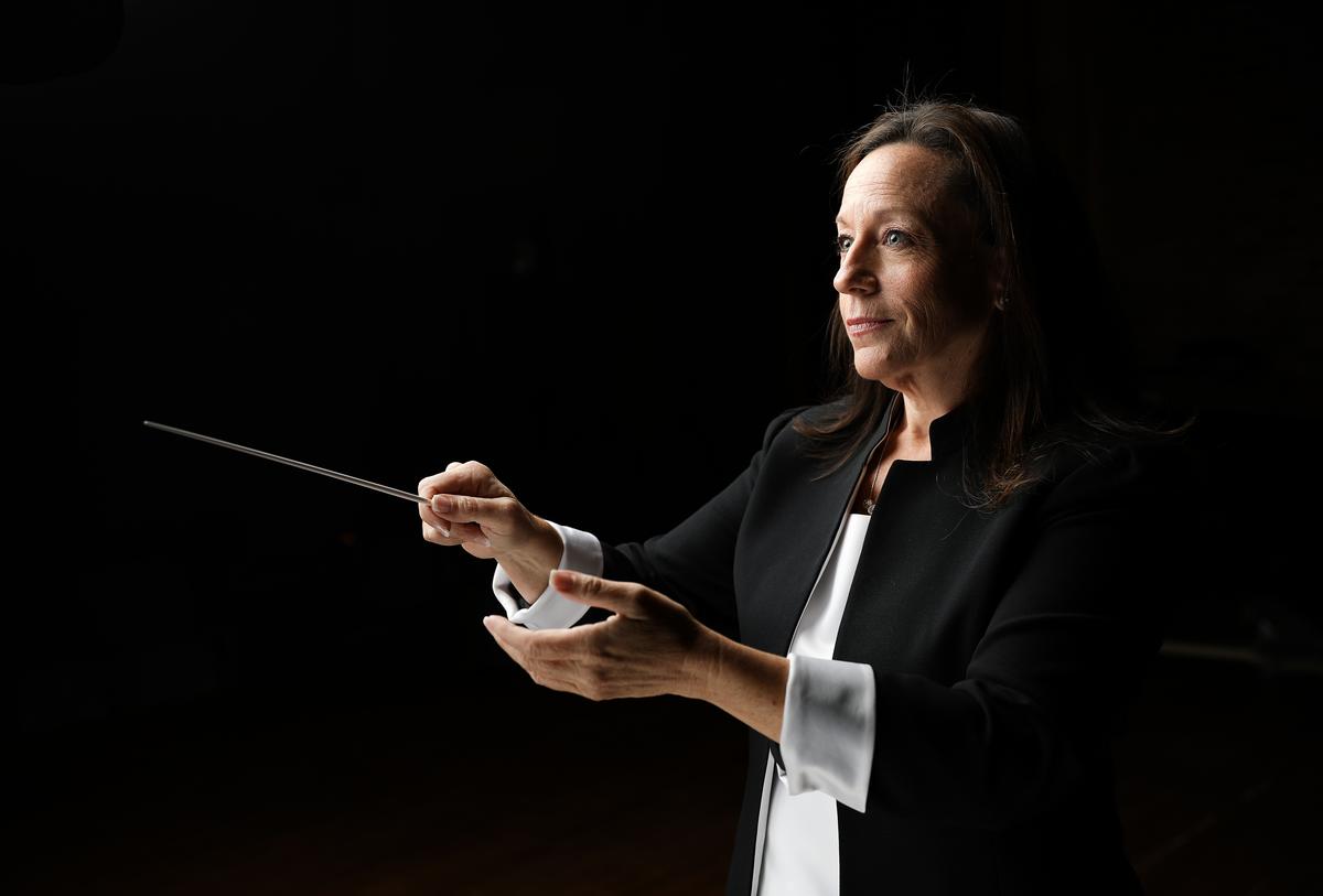 white woman conducting