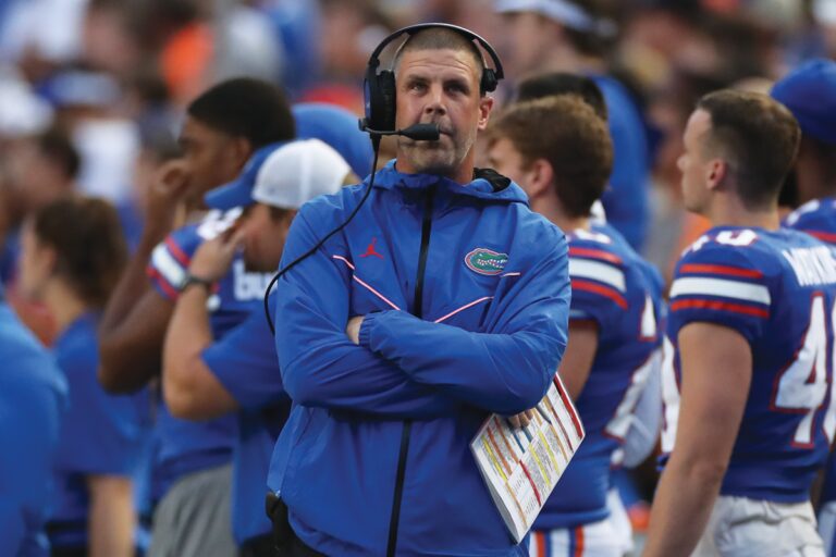 Florida Gators coach on the field during a game