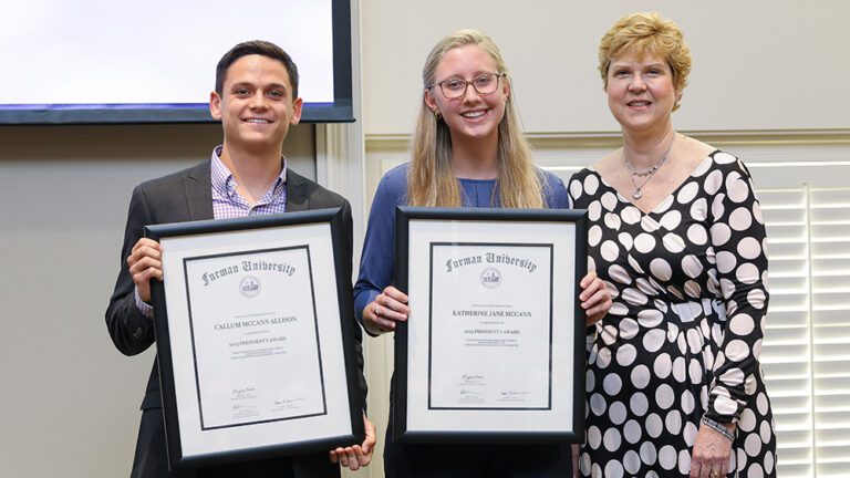 Furman University President Elizabeth Davis (right) presented the President's Awards to Callum Allison ’23 and Katherine McCann ’23.