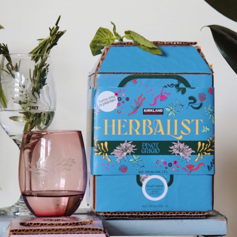 The wine box design with a glass next to it containing a plant