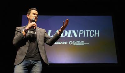 white man on stage at pitch competition, Bryan Davis
