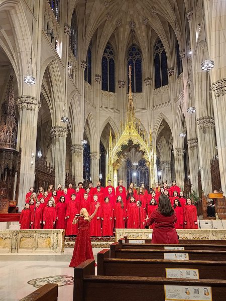 Choir in cathedral with soloist in foreground.