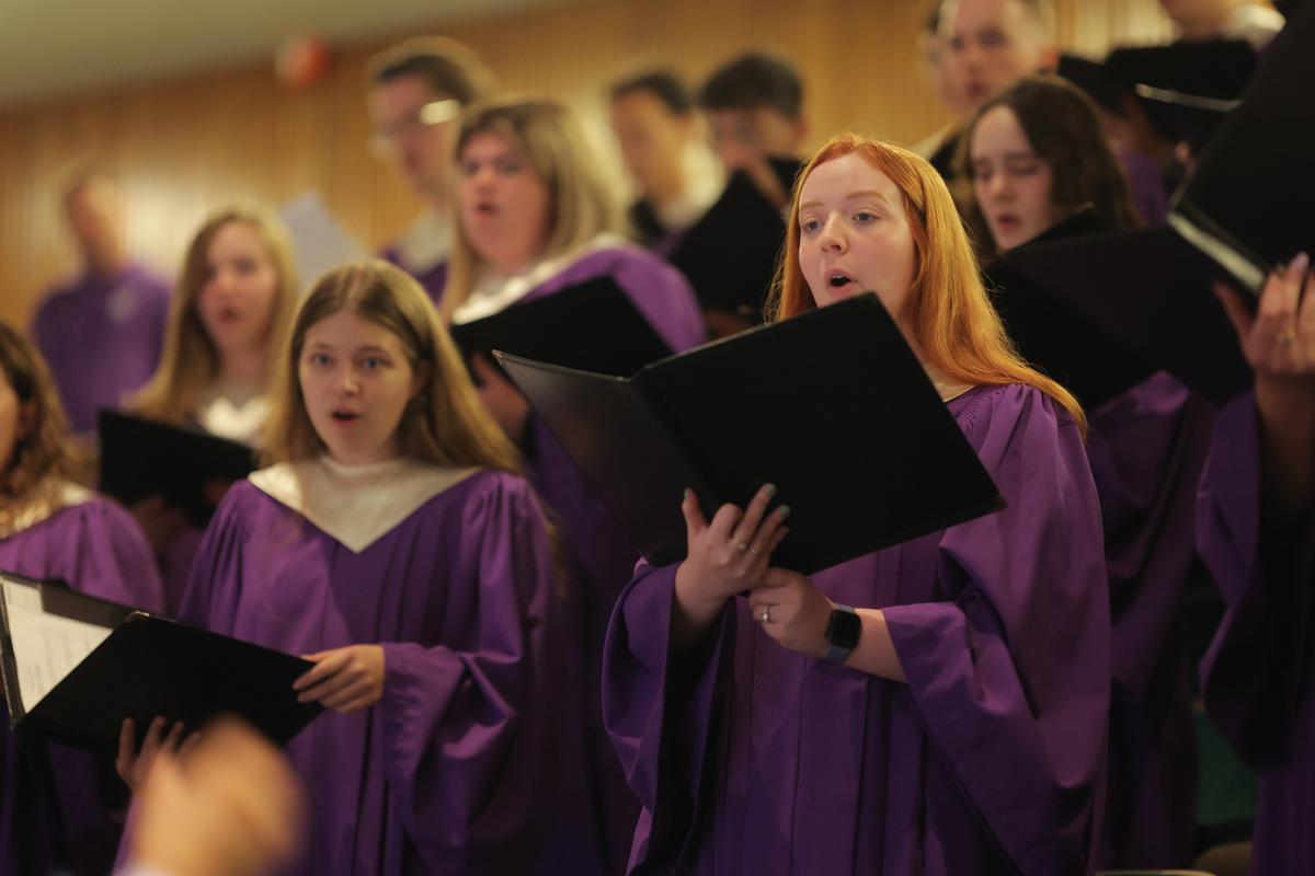 choir members in purple robes