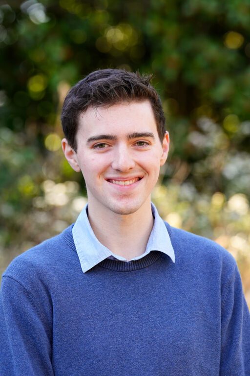 Man in sweater smiling