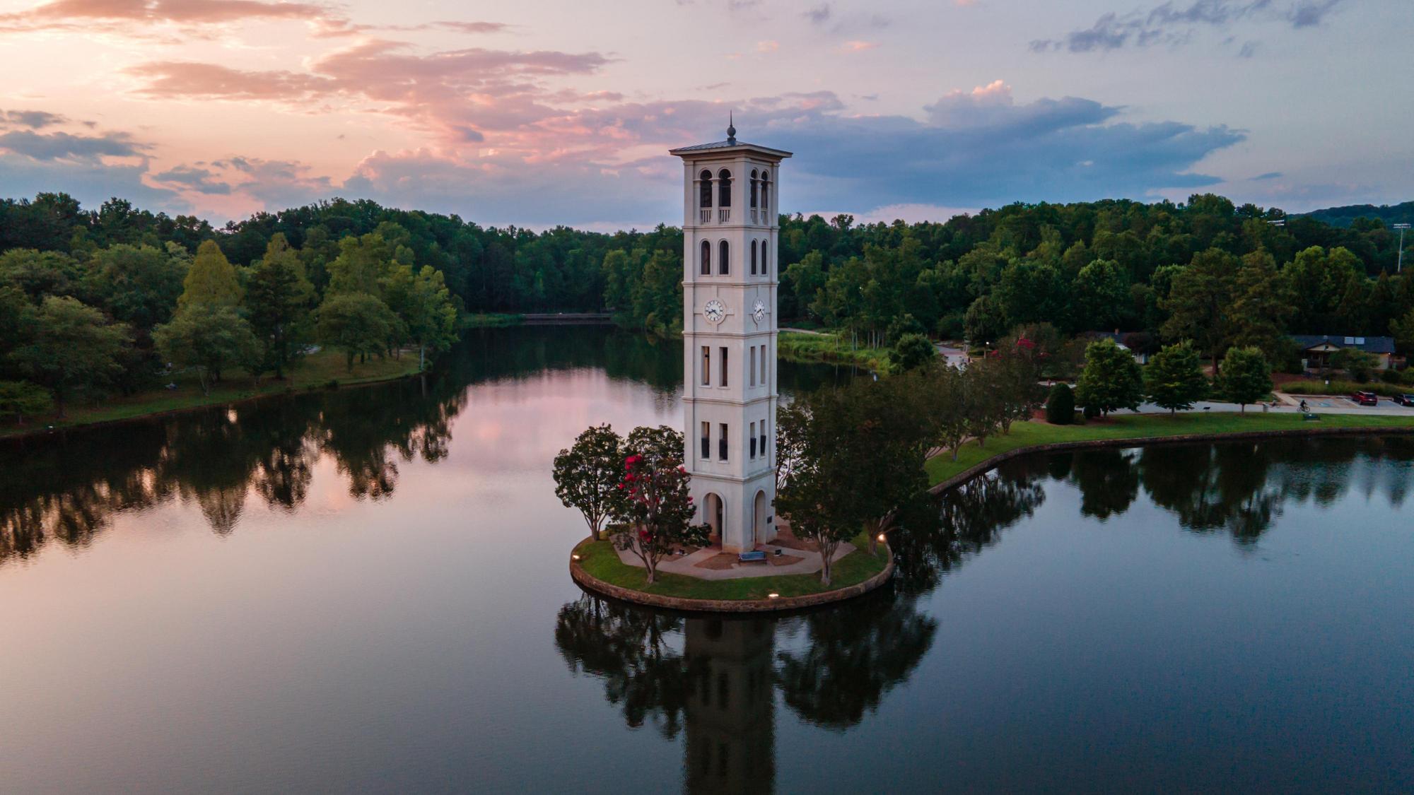 Italianate bell tower surrounded by water.