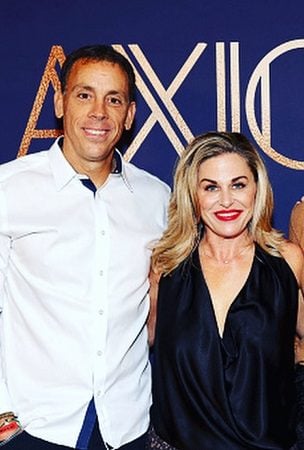 a white man in white shirt and a white woman in a black shirt