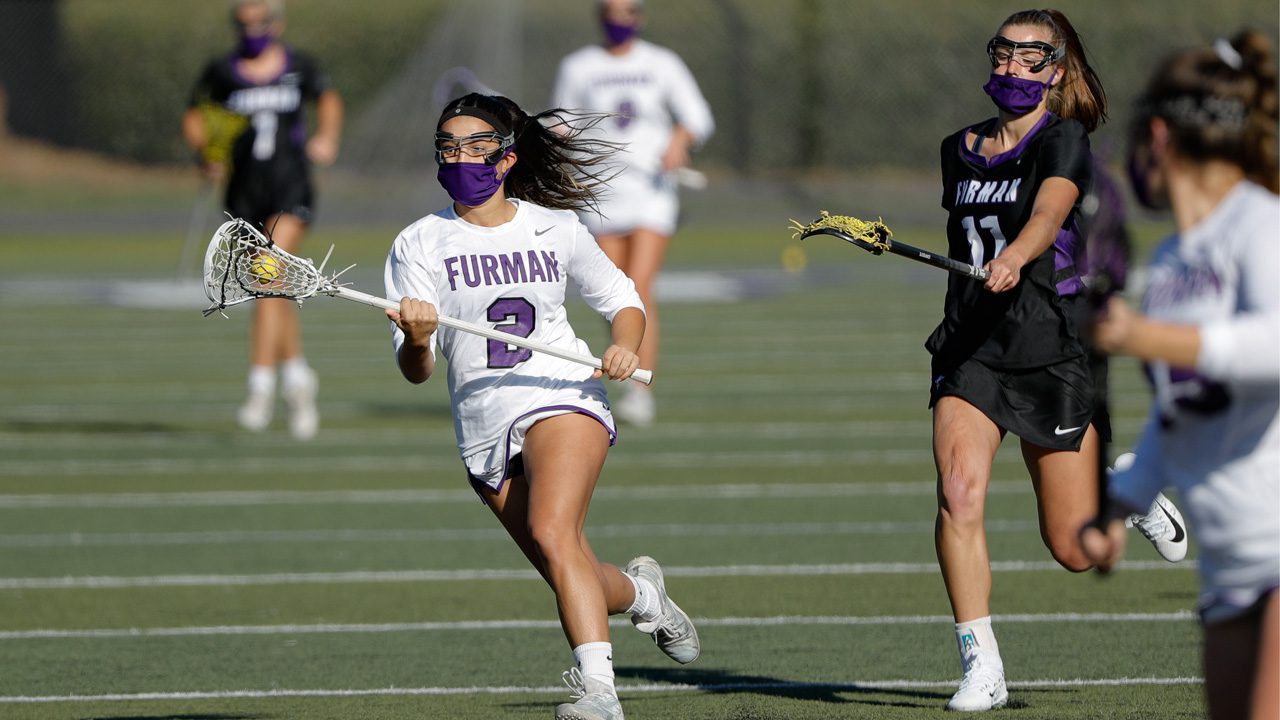 Women’s lacrosse players hold a scrimmage during Athletics’ Purple and White Week, which included in-person scrimmages and virtual events for on-campus students and student-athlete family members.