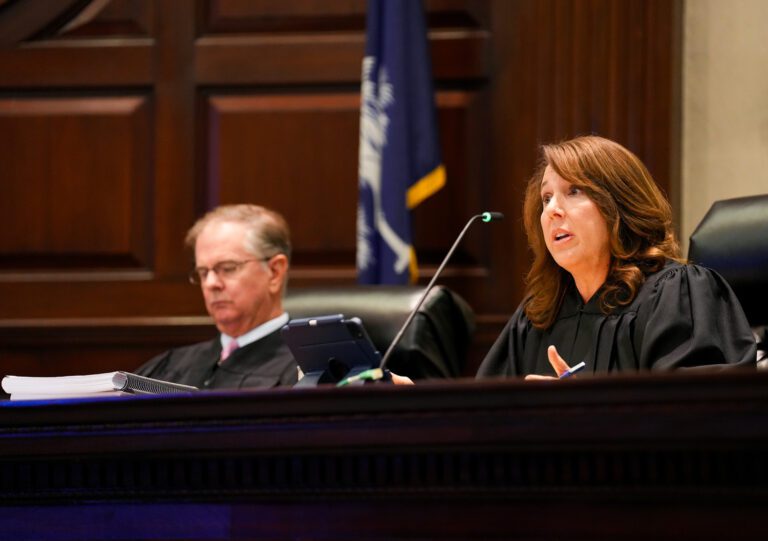 Justice Letitia Verdin ’92, right, hears a case with Justice George James Jr. and other justices (not pictured) during a South Carolina Supreme Court session