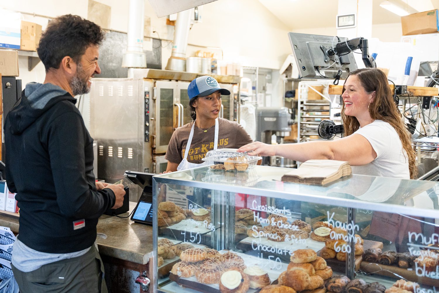 Cheryl Kraus ’09, right, owner of Upcountry Provisions in Travelers Rest waits on a customer. Photo by Owen Withycombe.
