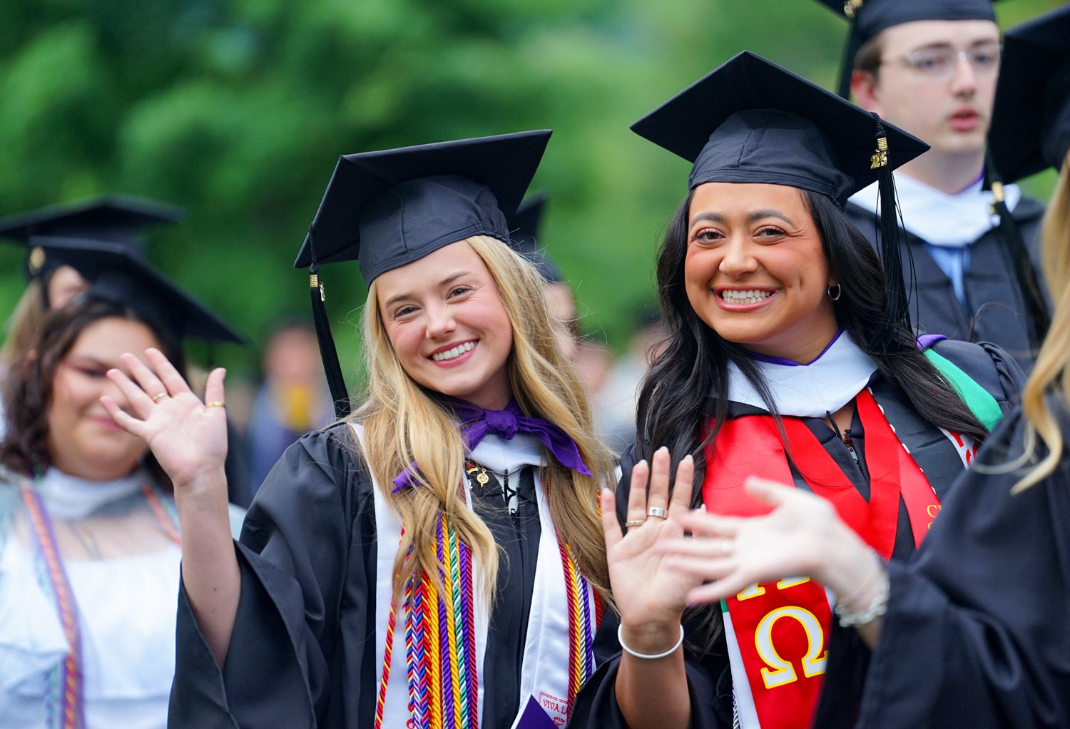Gracie Carroll ’25 and Chloe Canavati '25 walk from McAlister Auditorium to Paladin Stadium at the start of the commencement ceremony on May 10.