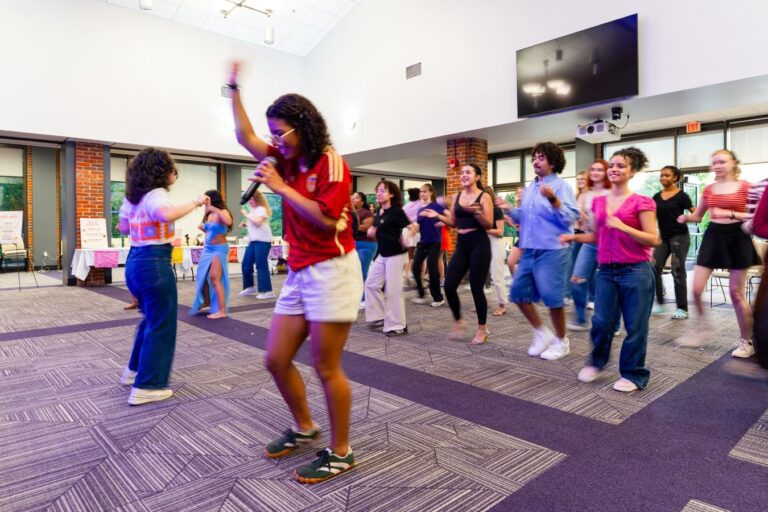 Students participate in a bachata dance class during HOLA’s Fiesta Hispana celebration.