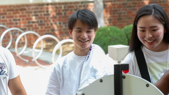 Kosuke Tateishi ’23 (left), a first-year exchange student, at the Campus and Community Connections Fair