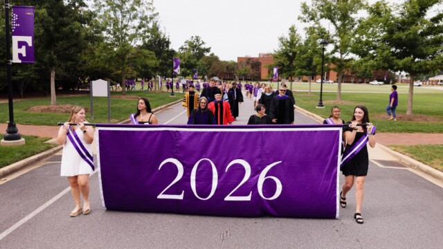 A procession down the Furman Mall begins the 2022 Opening Convocation.