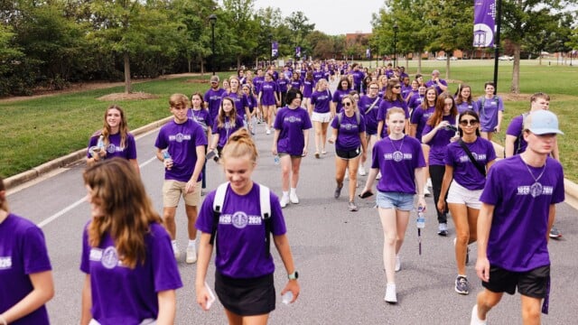 First-year students approach McAlister Auditorium in a procession before Opening Convocation.