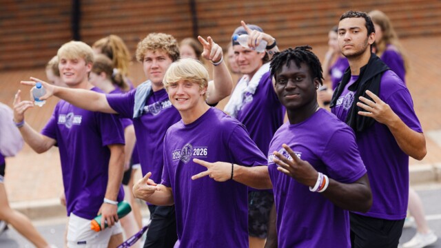 First-year students approach McAlister Auditorium in a procession before Opening Convocation.