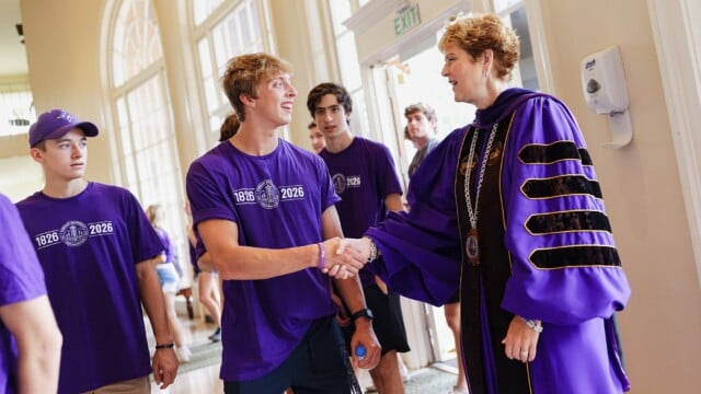 Furman University President Elizabeth Davis greets members of the Class of 2026 as they enter McAlister Auditorium for Opening Convocation.