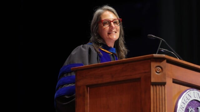 Beth Pontari, interim vice president for academic affairs and provost and professor of psychology, at the podium during Opening Convocation.