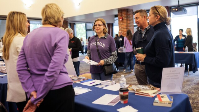 Gayle Rhodes '25 and family learn about a study away experience during Family Weekend.