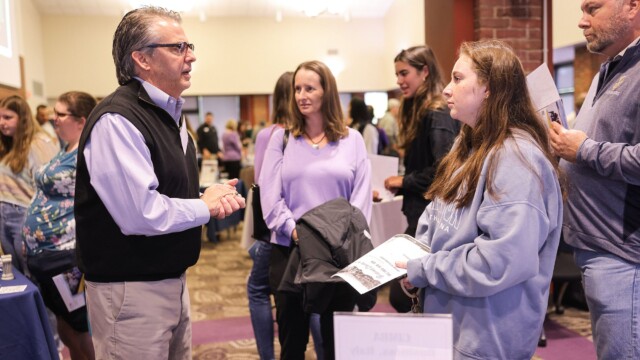 Reagan Orsagh '25 (right) talks with Robert Underwood, the Robert E. Hughes Associate Professor of Business.