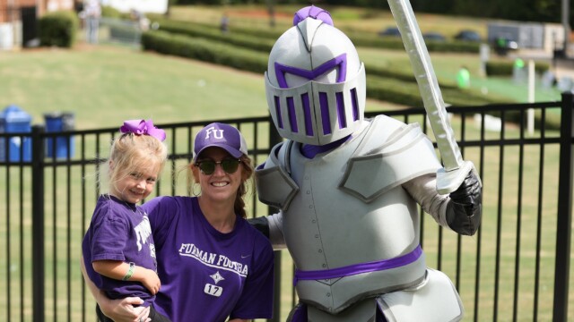 Victor (right) poses with some fans outside Paladin Stadium.