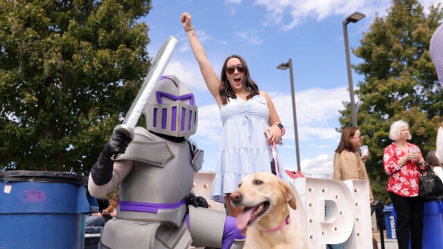 Emma Gray '25 (right) with Victor outside Paladin Stadium