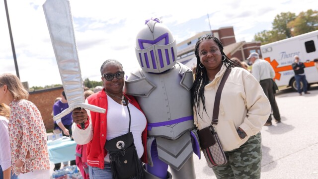 The Harrell family with Victor (center) outside Paladin Stadium