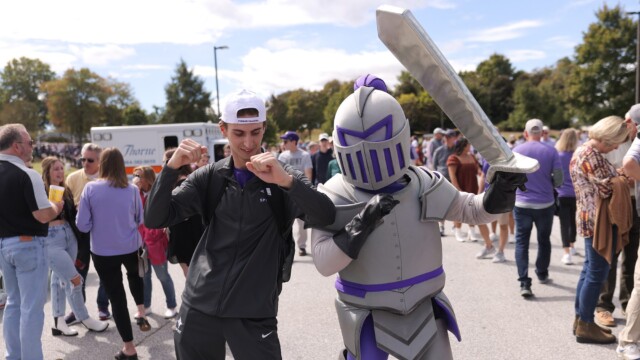 Luke Sommerdyke '24 (left) with Victor outside Paladin Stadium
