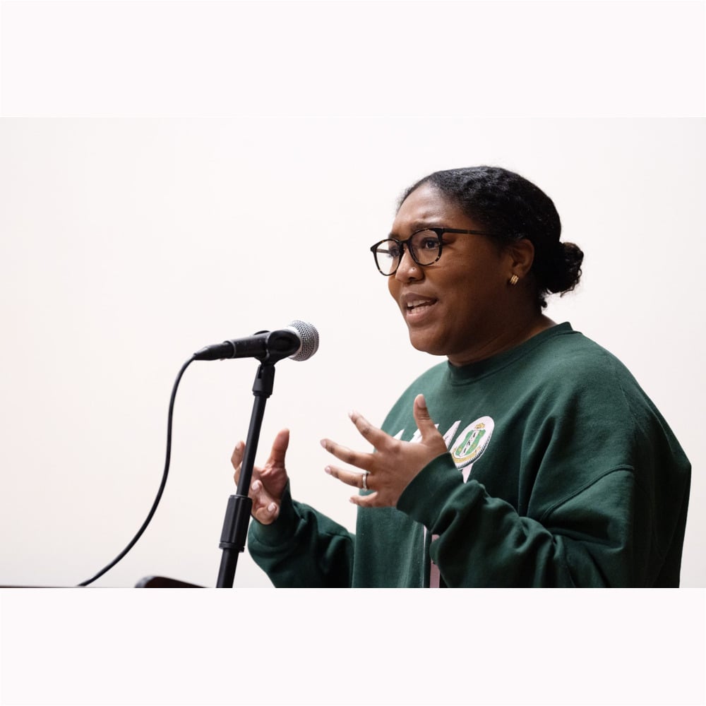 Jocelyn Boulware Bruce ’17, assistant director of the Center for Inclusive Communities, speaks in the Burgiss Theater at the Trone Student Center during the MLK Interfaith Celebration and Breakfast at Daniel Chapel on Monday, January 16, 2023.