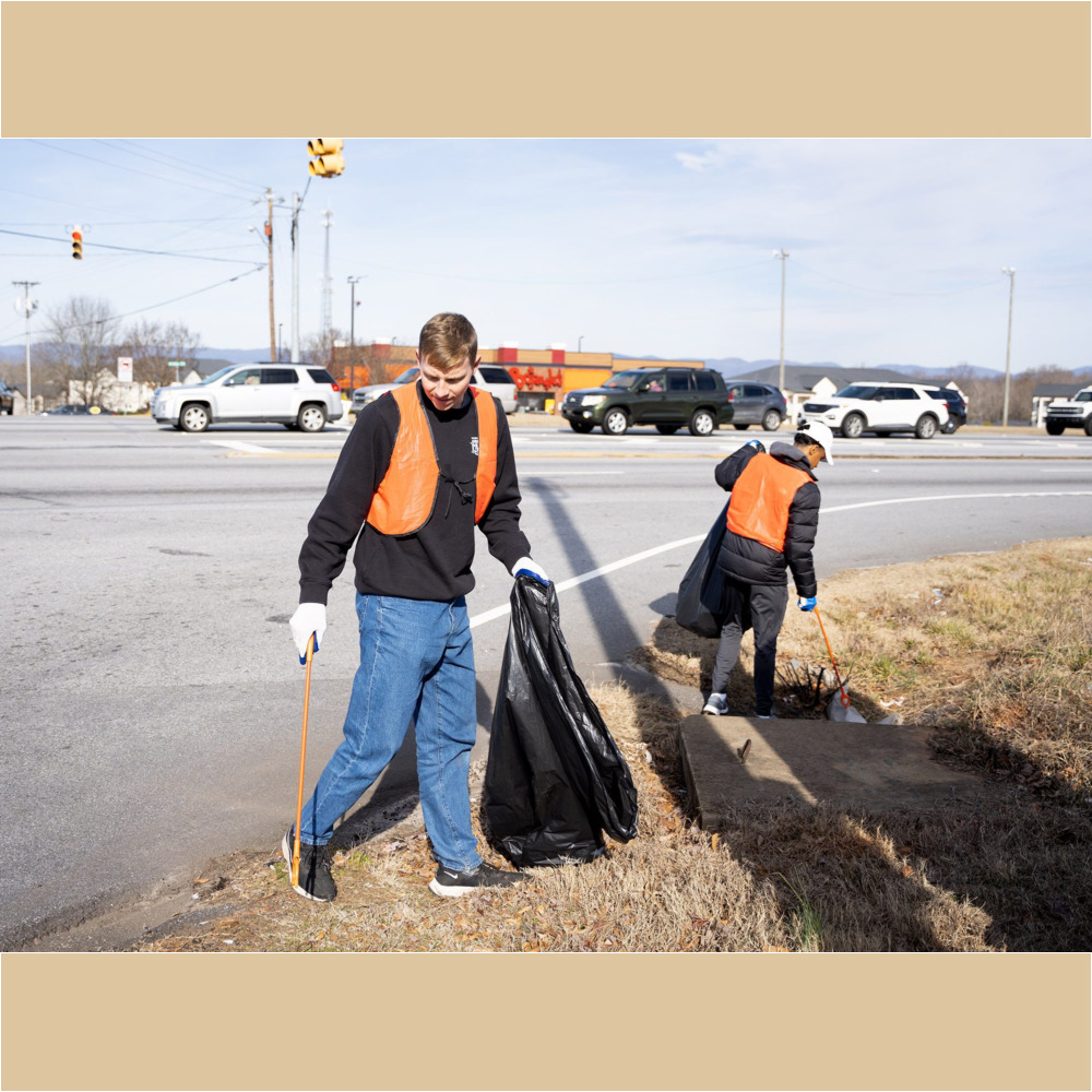 Furman men’s soccer player Denison Jones ’24 and Christian Newman ’24 help pick up trash along US Highway 25 in Travelers Rest as part of the MLK Day of Service on Monday, January 16, 2023.
