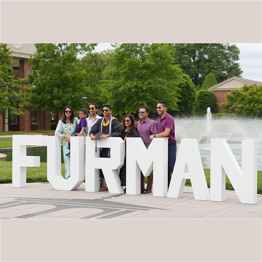 A student poses for a photo prior to the May 6 Commencement ceremony.