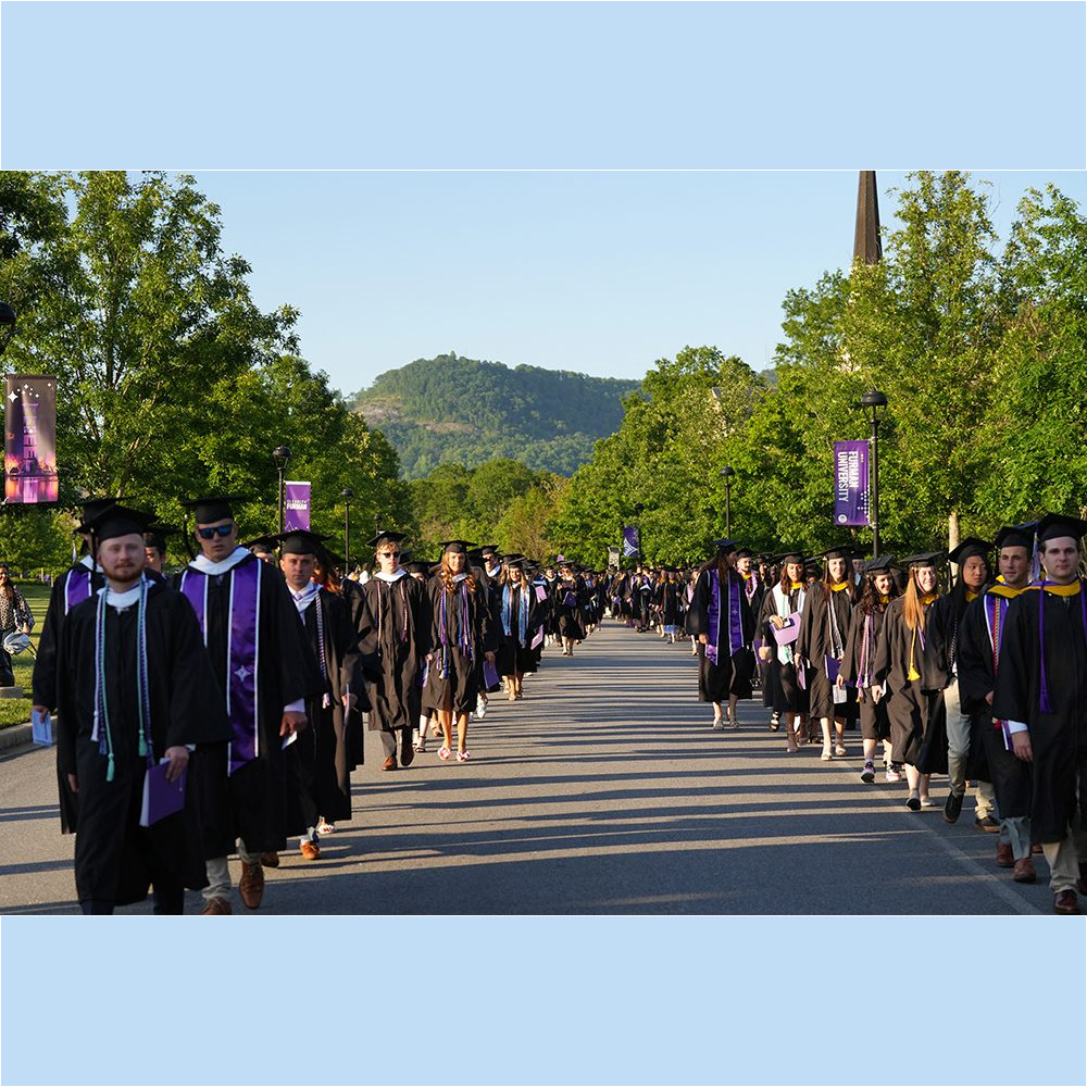 Members of the Class of 2023 proceed up Furman Mall into Paladin Stadium at the beginning of the May 6 Commencement ceremony.
