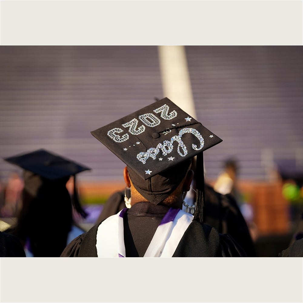 A student displays a decorated mortarboard during the Commencement exercises on May 6.