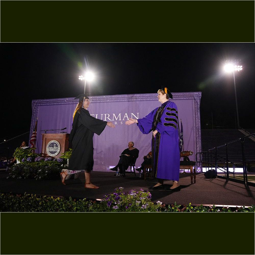 Furman University President Elizabeth Davis congratulates a student during the Commencement ceremony on May 6.