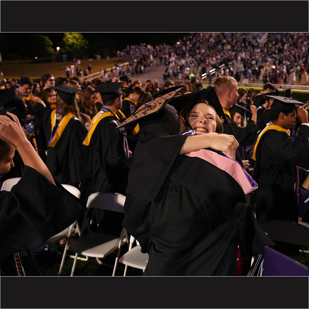 Graduates celebrate in Paladin Stadium after the May 6 Commencement ceremony.