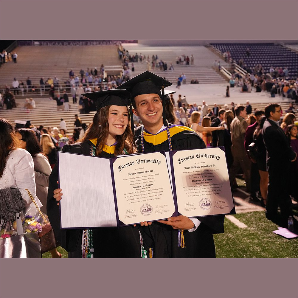 Brooke Spears '23 and Jerry Blackburn '23 pose with their diplomas after the Commencement ceremony on May 6.