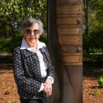 Betty Stall stands at her marker on the Benefactors Green on Saturday, April 13, 2024.