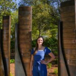 Catherine Lydia Morris ’20 stands at her marker on the Benefactors Green on Saturday, April 13, 2024.