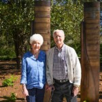 Sherry Atkinson and Tom Atkinson ’58 stand at their marker on the Benefactors Green on Saturday, April 13, 2024.