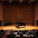 Students perform a piano recital in Daniel Recital Hall.