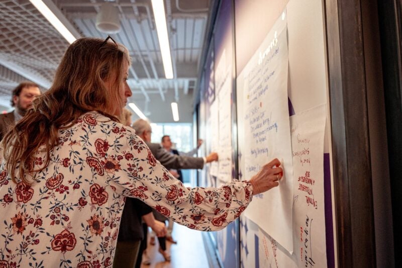 Woman writing on the wall