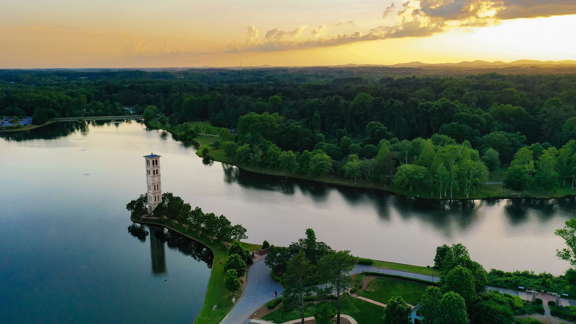 Bell tower, aerial view, with sunrise over mountains