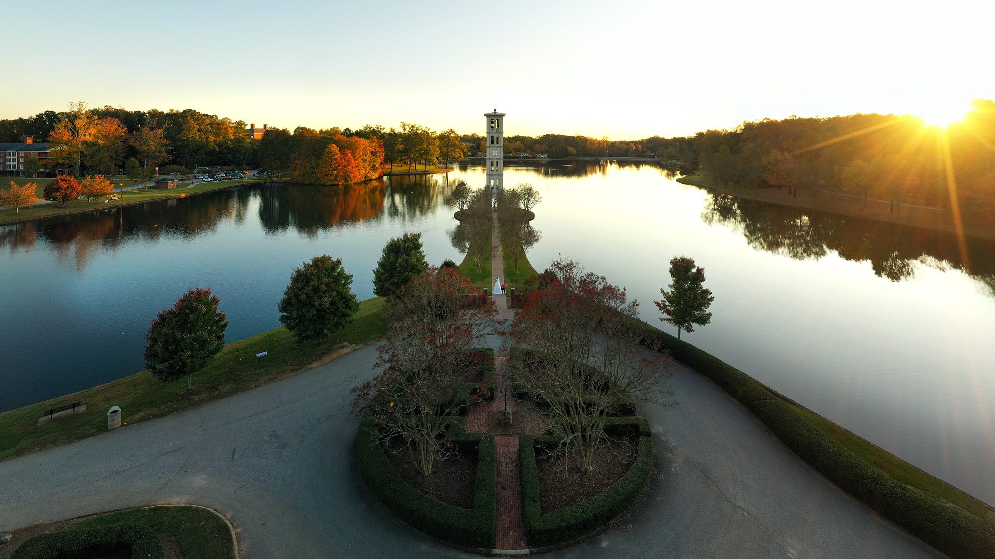 Sunset over the lake, bell tower in distance