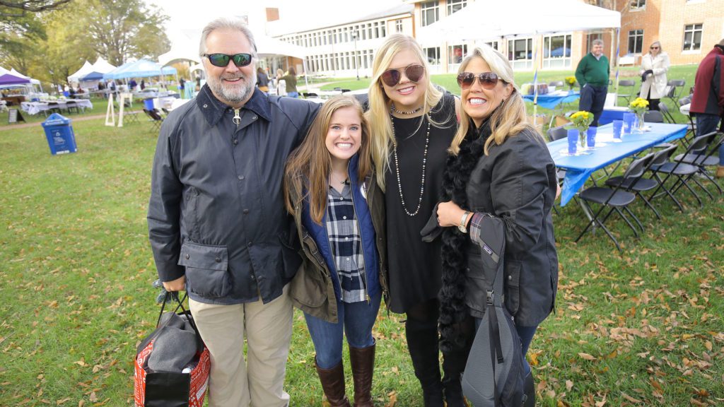 Student with her family during Family Weekend